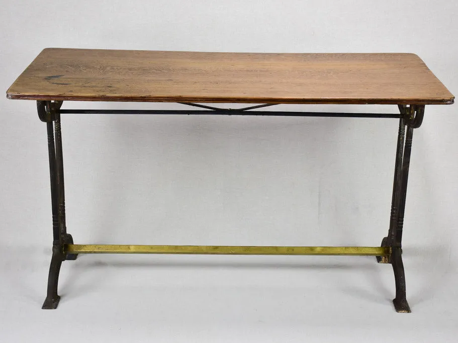Antique French bistro table with oak top and cast iron base 25¼" x 51¼"