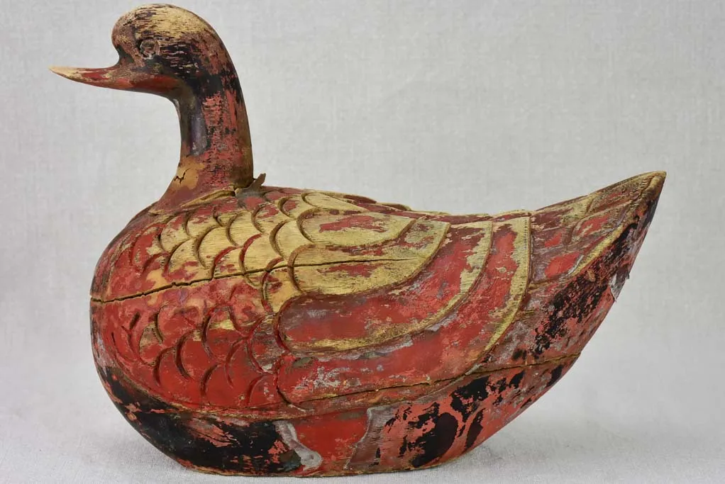 Antique French carved wooden sculpture of a duck with red patina - 1930's