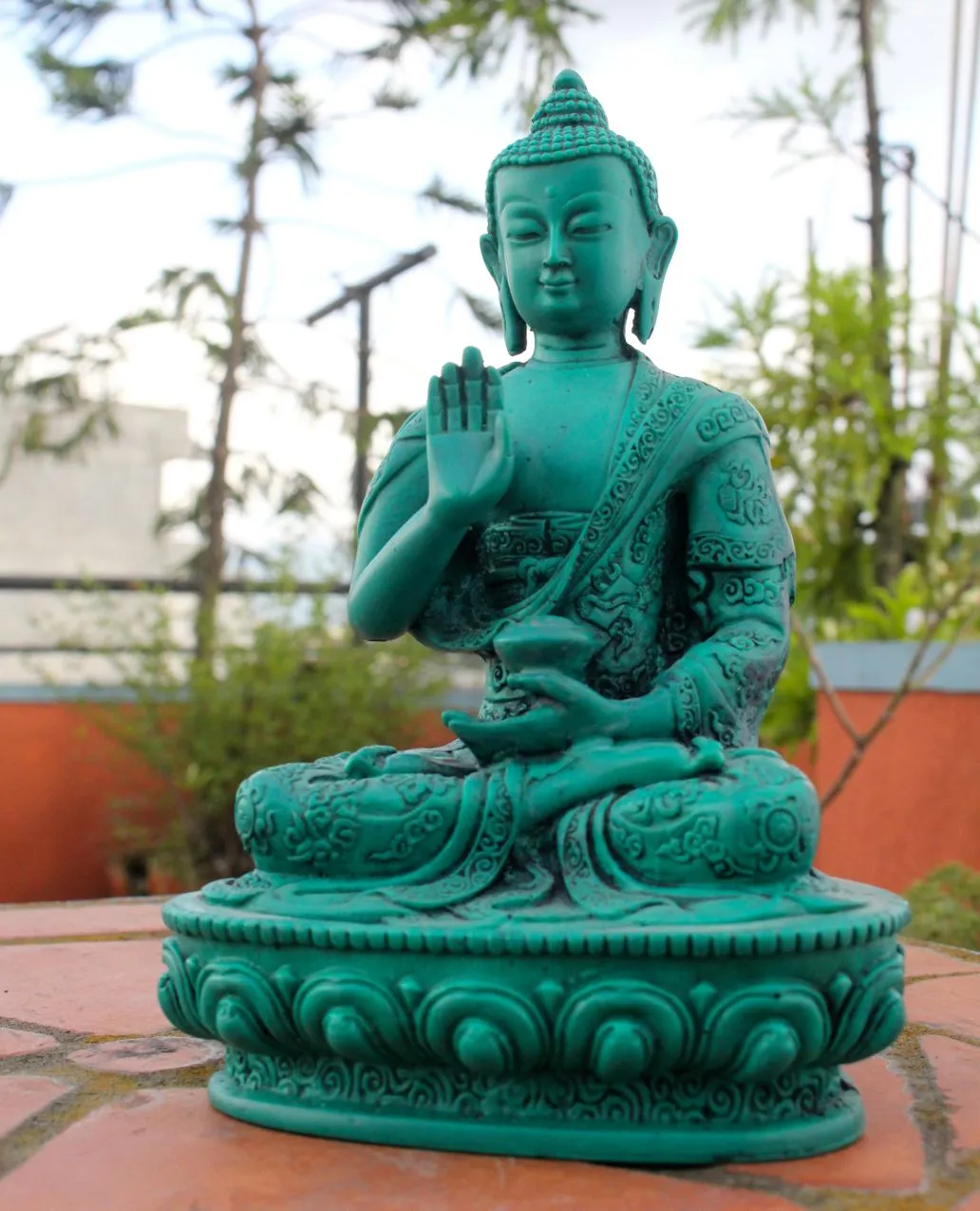 Floral Motifs Carved Green Amoghasiddhi Buddha Resin Statue 7 inch High