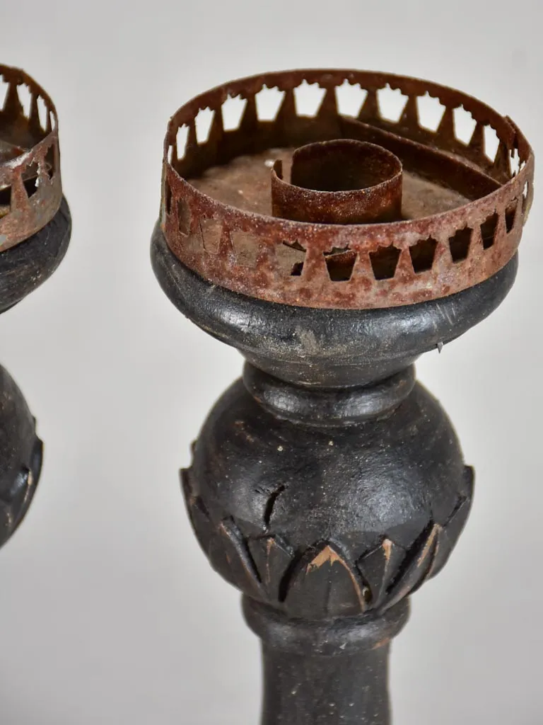 Three twentieth-century French wooden candlesticks with black paint finish 15"